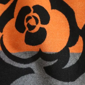 Winter camellia scarf in soft imitation cashmere with orange and black floral patterns