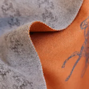 Double-sided winter scarf with horse pattern and orange contrast lining