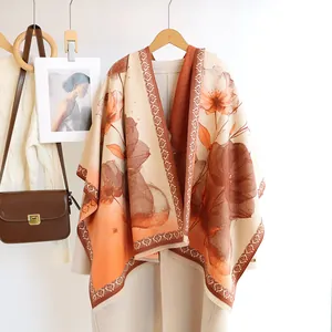 Detailed view of autumn winter floral print cashmere-like shawl with geometric border