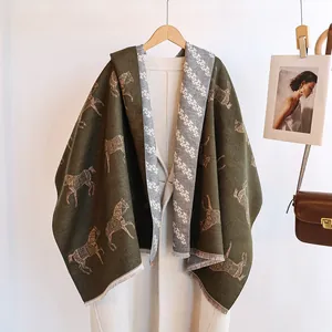 Close-up of double-sided horse pattern scarf with letter jacquard and fringe edges