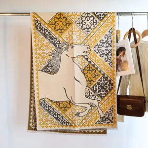 Detail of horse jacquard pattern and fine tassel fringe on cashmere feeling scarf