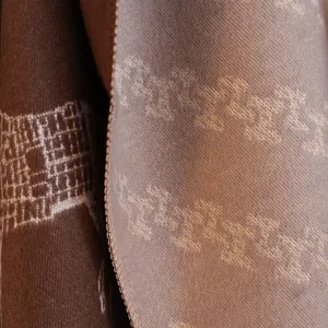Detail of reversible horse design scarf showing fine cashmere texture and edge stitching