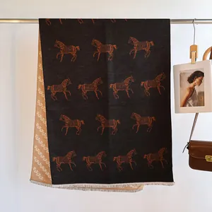 Detailed view of horse pattern and letter jacquard on double-sided cashmere shawl