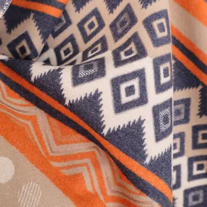 Macro detail of Maya ethnic geometric knit pattern on thick cashmere-like scarf