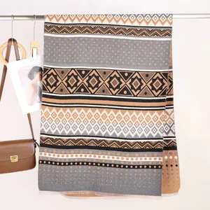 Detail of Mayan geometric pattern shawl with fringe and soft cashmere-like texture