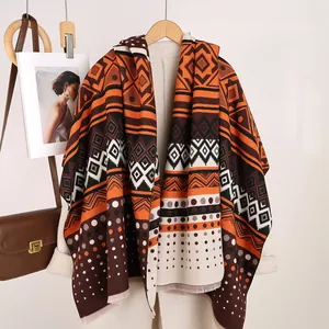 Detail of Mayan style cashmere-feel shawl with geometric patterns and fringe