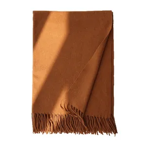 Caramel wool scarf with fringe tassels for men and women showing warm winter texture