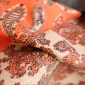 Classic paisley pattern cashmere pashmina shawl in vibrant orange and cream beige colors