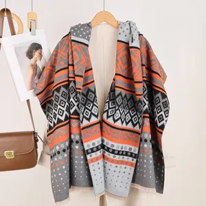 Detail of Mayan geometric pattern shawl with fringe and soft cashmere-like texture