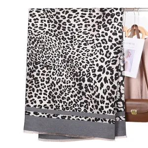 Fashionable leopard print cashmere-like scarf with grey paneling and tassels