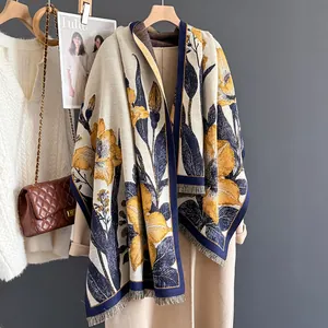 Elegant floral thick scarf with yellow lilies and tassels on a beige coat