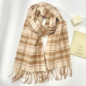 Detailed close-up of British style checkered wool scarf with soft tassels and woven texture