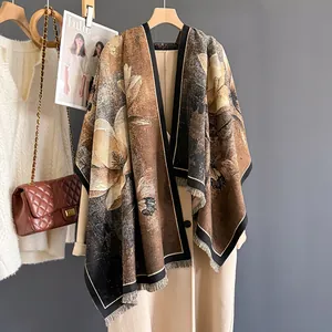 Detailed texture of a brown cashmere shawl scarf with elegant floral oil painting pattern