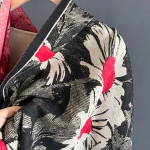 Detailed view of the soft knitted texture and metal zipper on the floral scarf