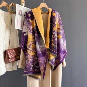 Detail of purple and yellow star-patterned cashmere scarf with fine fringe tassels
