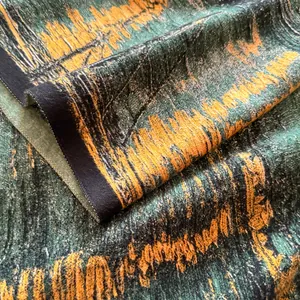 Sciarpa pashmina spessa con motivo astratto verde e arancione in soffice finta cashmere