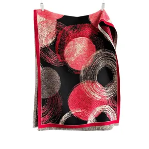 Thick faux cashmere shawl with abstract red and white circles and fringe trim