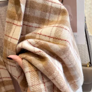 Classic wool-feel plaid scarf in camel and beige tones with a soft textured finish
