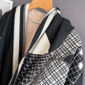Detail shot of the jacquard knit pattern and edge stitching on this thick winter scarf