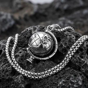 Rotating stainless steel globe pendant necklace with world map detail on volcanic rock