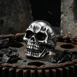 Gothic skull ring for men in polished stainless steel with industrial gears background