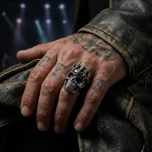Men's gothic skull ring with spiked crown in vintage silver finish worn on hand