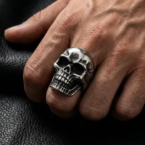 Close-up of vintage steel skull ring for men with punk gothic design on leather