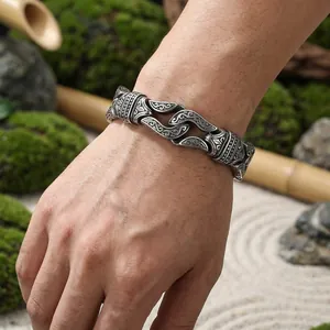 Close-up detail of vintage geometric punk titanium steel bracelet on male wrist