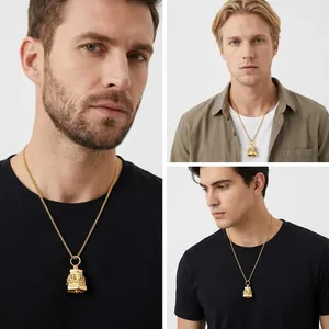 Detailed view of punk style gold bell pendant with skull relief on male models
