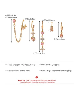 Size chart showing six gold ear piercing set dimensions with pink heart crystals