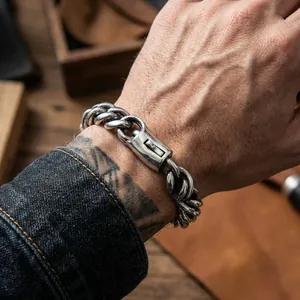 Rugged men's titanium steel curb chain bracelet with polished push clasp on wrist