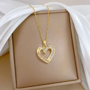 Elegant gold titanium necklace with heart-shaped pendant set with baguette cubic zirconia