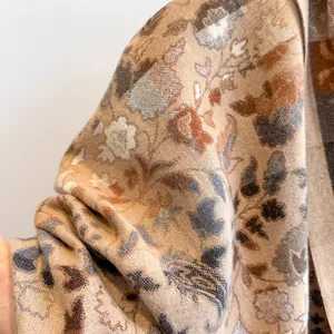 Classic paisley cashmere-like winter scarf featuring rich woven floral patterns in beige and blue