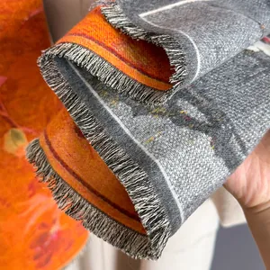 Detail view of ethnic oil painting floral scarf with fine gray tassels and soft texture