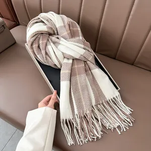 Classic plaid warm scarf in brown and cream with long tassels for autumn and winter
