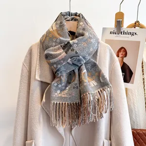 Detail of bohemian floral pashmina scarf with long fringes over a wool coat