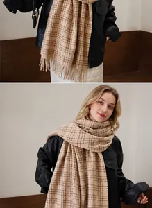 Close-up of classic beige plaid scarf featuring soft texture and long tassel details