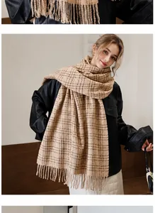 Close-up of classic camel plaid scarf with tassels and soft cashmere-like texture