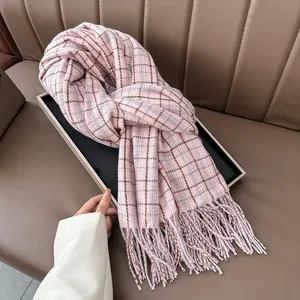 Close-up of pink plaid scarf texture featuring soft imitation cashmere and fringe edges