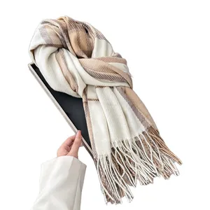 Thick plaid winter scarf with fringe tassels in beige and brown neutral tones