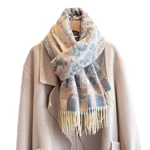 Ethnic paisley floral cashmere feel winter scarf with elegant tassels on beige coat