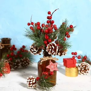 Mini pine needle Christmas tree in brown glass bottle with berries and pinecones