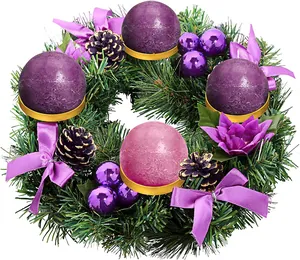Detail of Christmas advent wreath with purple candles, pine cones and festive ornaments