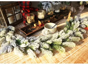 Detail of snowy PE pine needle garland with realistic flocking for Christmas home decor