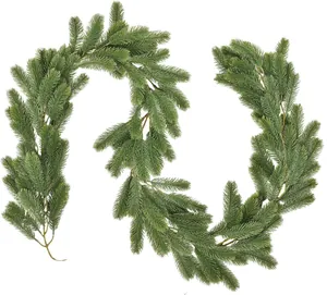 Detailed macro view of dense artificial green pine needle garland with realistic PE branches