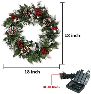 Detail view of 18 inch flocked Christmas wreath with pine cones and 50 LED lights
