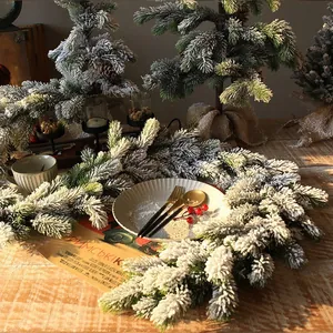 Realistic snow-flocked Christmas garland and pine tree set with rustic burlap base