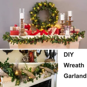 Illuminated 5.5m Christmas garland with red berries and pine cones on a fireplace mantel