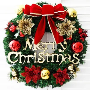 Detailed Christmas wreath with red bows, gold ornaments, and Merry Christmas sign