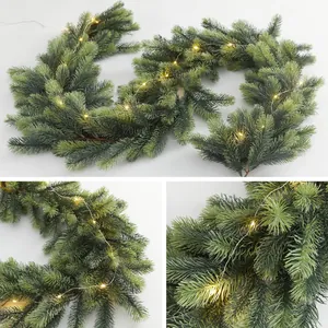 Artificial Christmas garland with soft pine needles and warm LED lights for holiday decor
